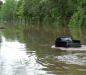 furniture floating on a flooded street